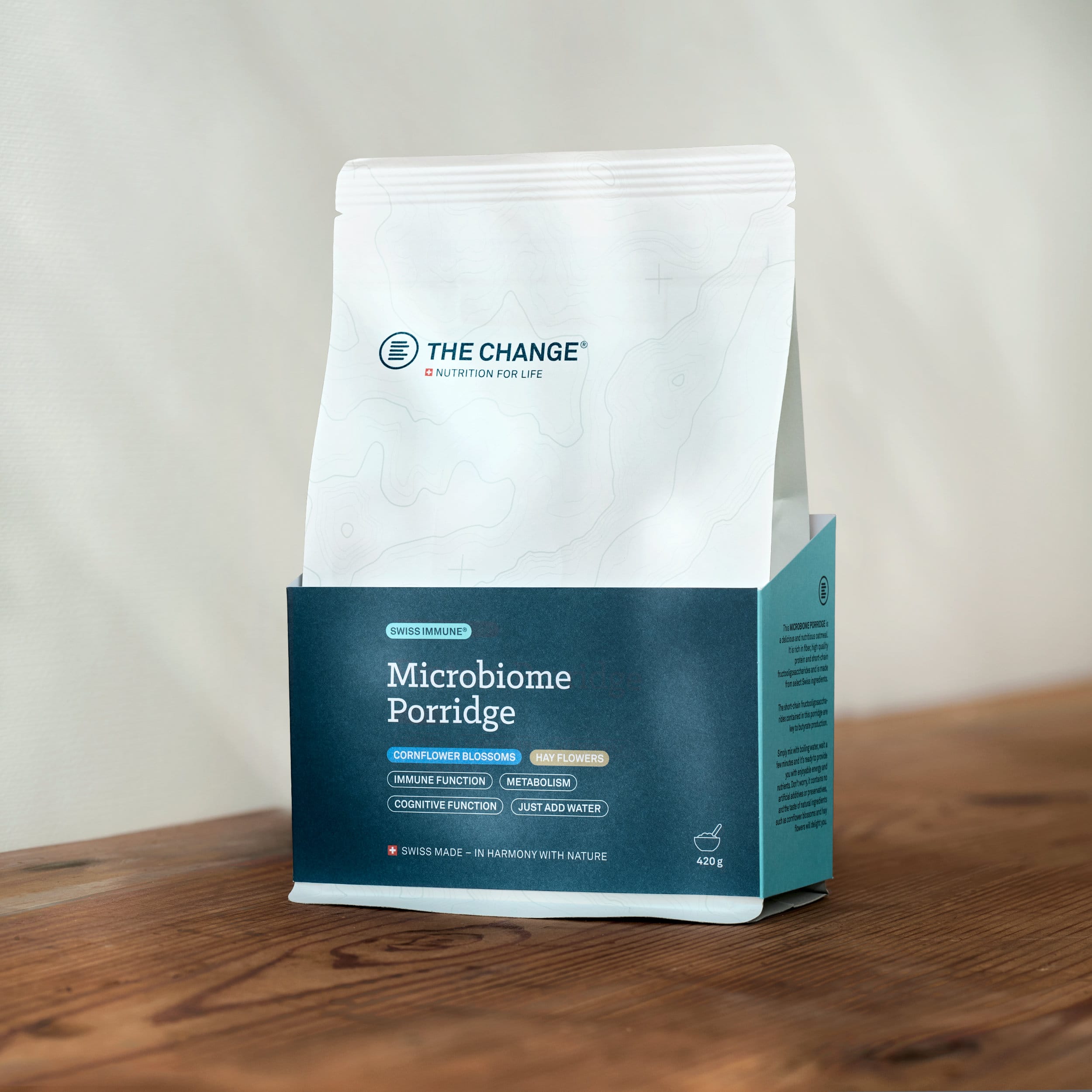 Swiss-made Microbiome Porridge in a sleek white and teal packaging, promoting gut health and wellness.