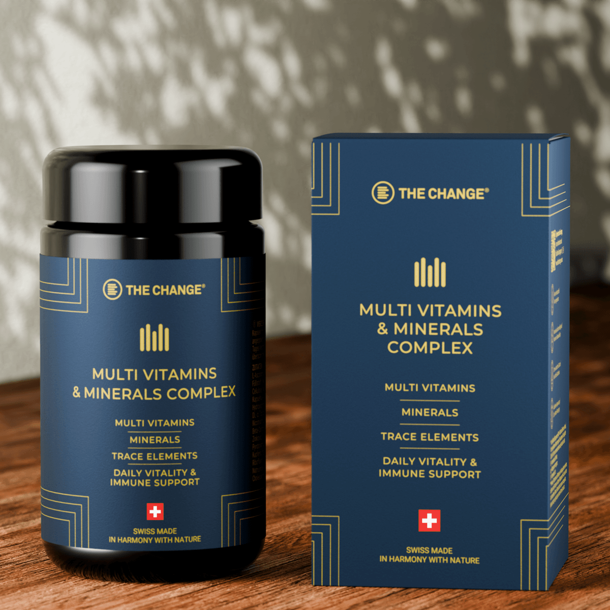 Navy blue multi vitamins and minerals complex bottle and box, featuring Swiss-made label and gold accents.