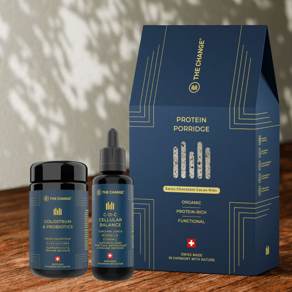 Organic protein porridge with Swiss chocolate cacao nibs, featuring colostrum and probiotics, in elegant navy packaging.