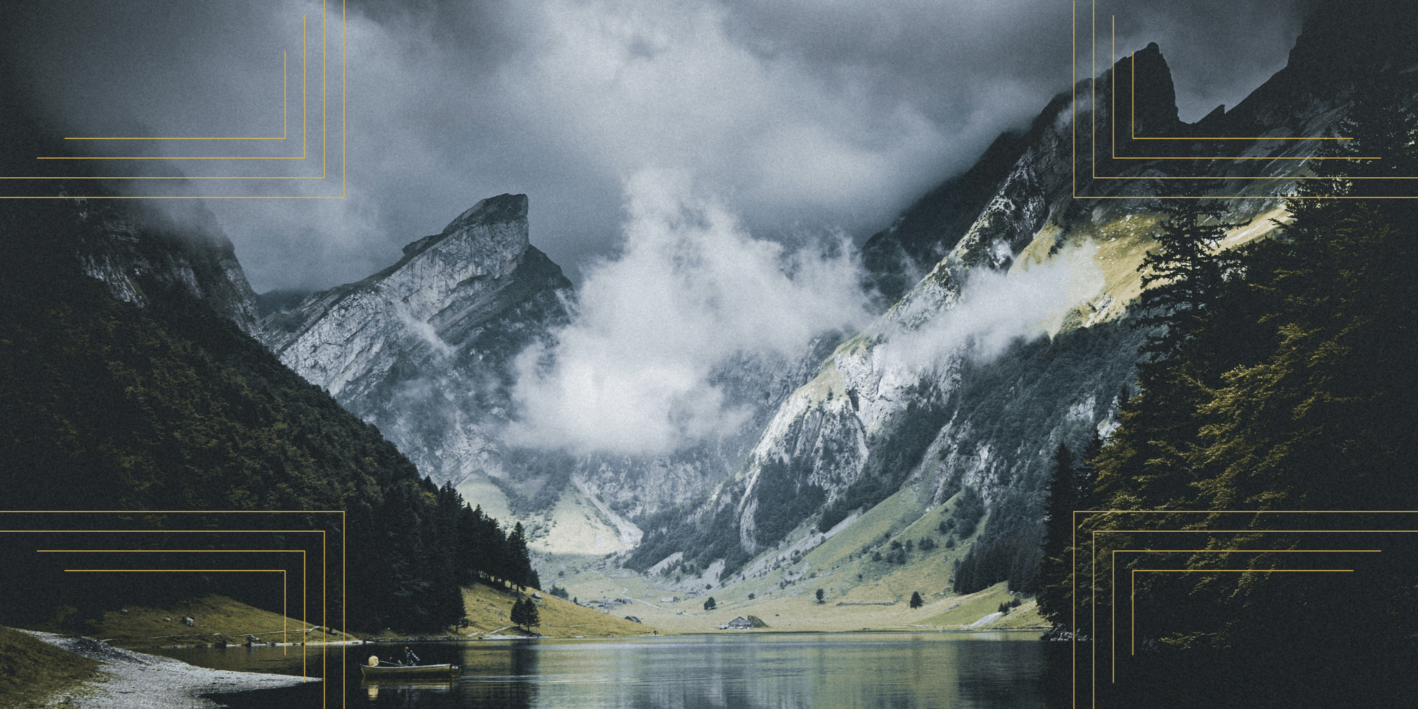 Scenic landscape photo of dark mountains and lush greenery reflecting on a calm lake under a cloudy sky.