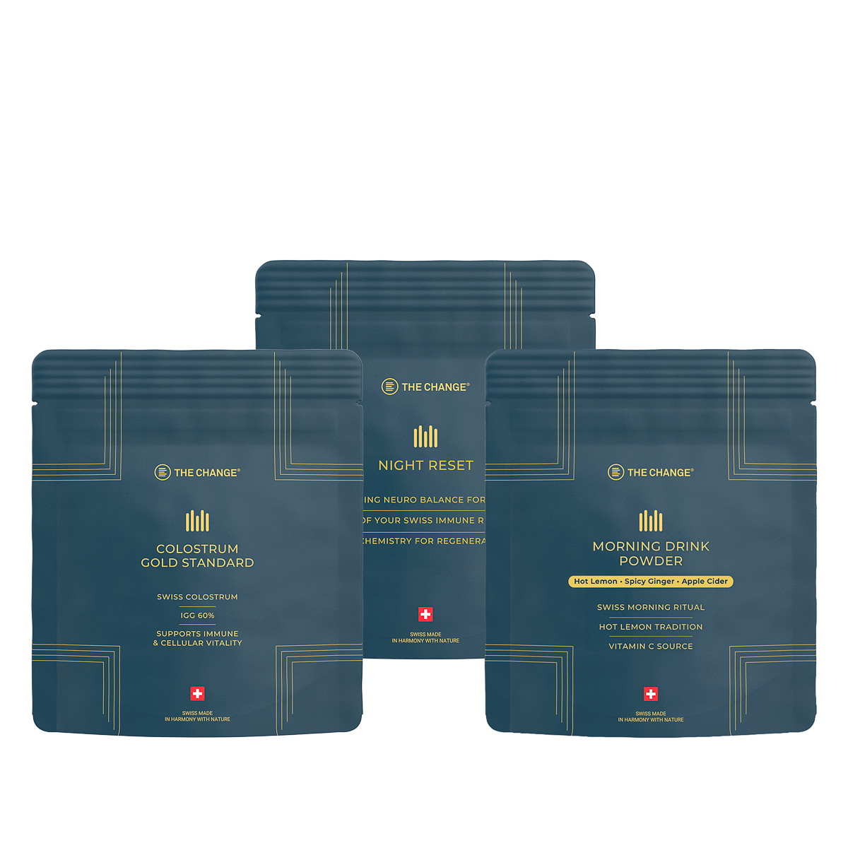 Three product pouches in navy blue: Colostrum Gold Standard, Night Reset, and Morning Drink Powder, all for wellness.